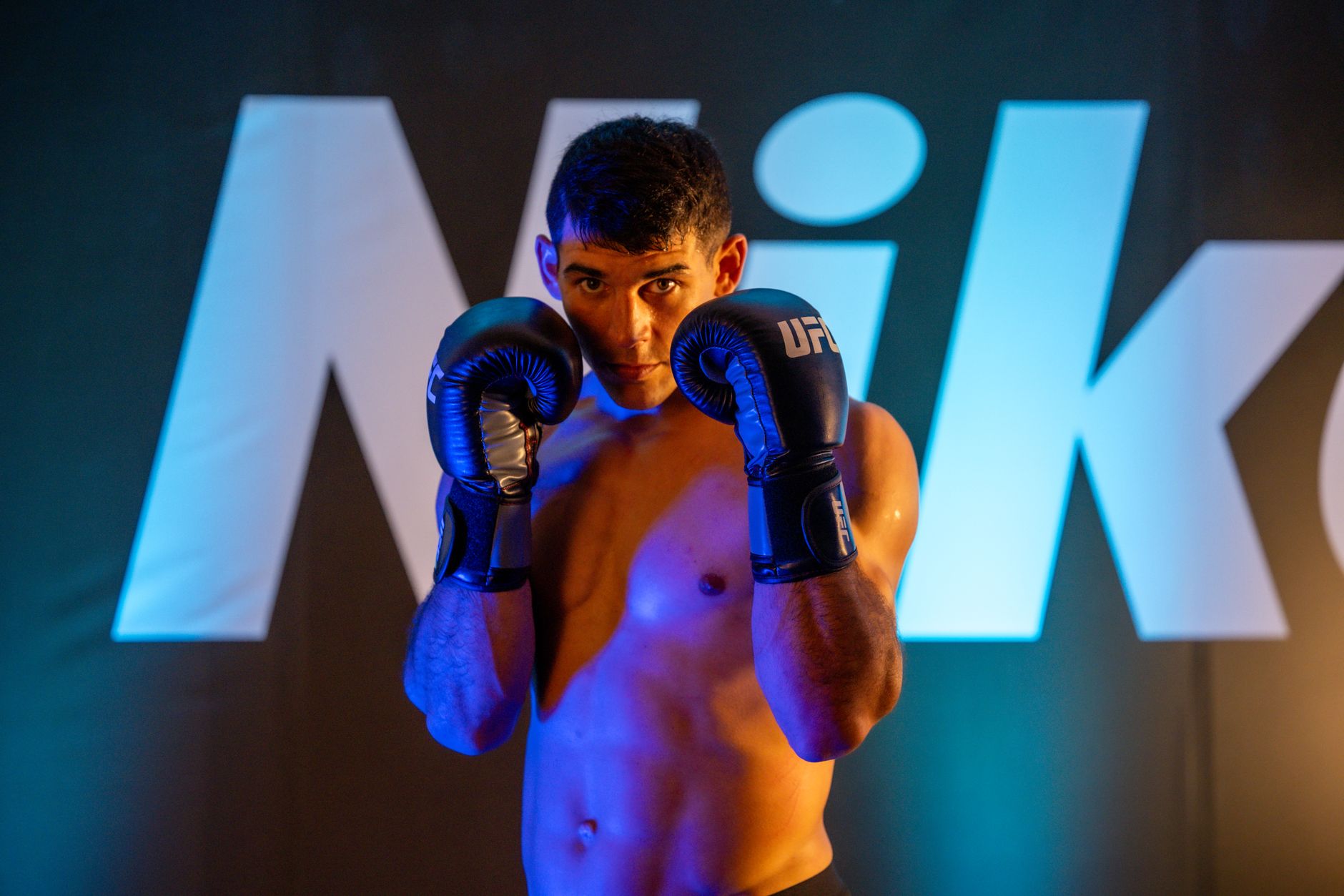 Focused boxer training in a Mexico City gym, showcasing strength and determination.