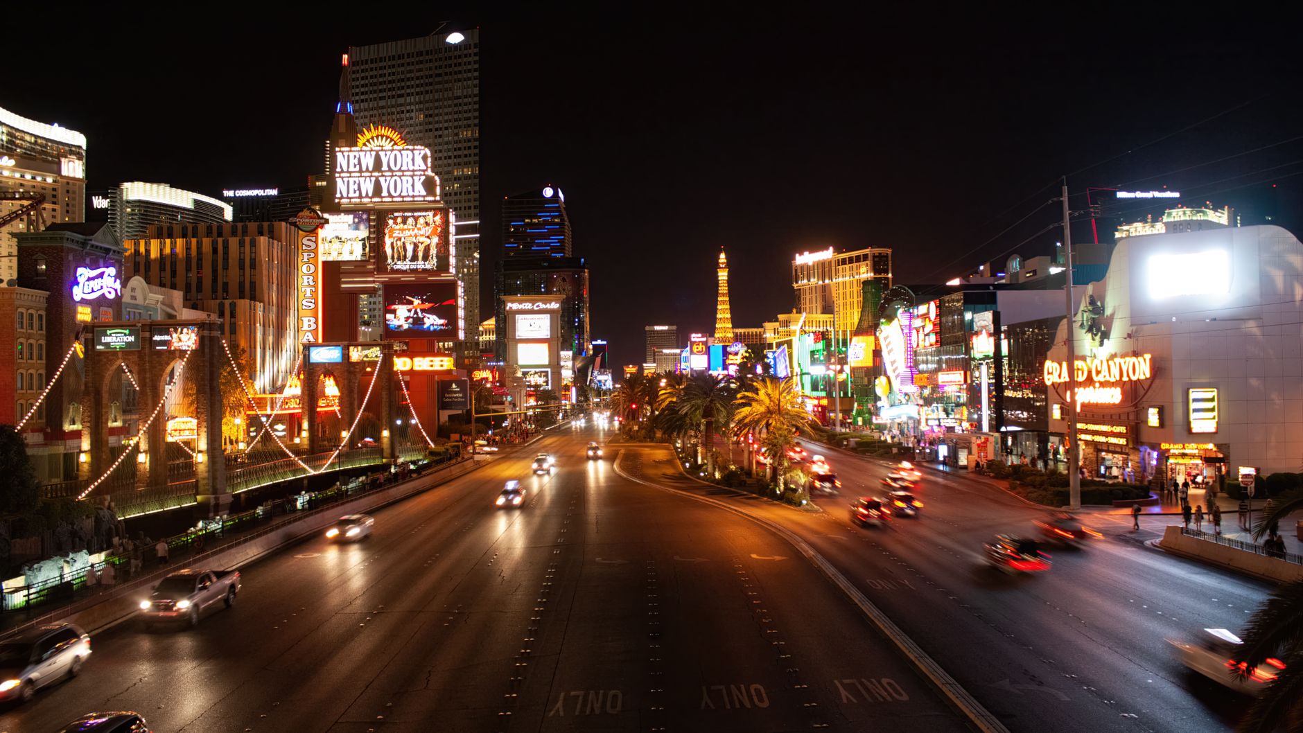 Experience the illuminated Las Vegas Strip with iconic hotels, lights, and bustling nightlife.