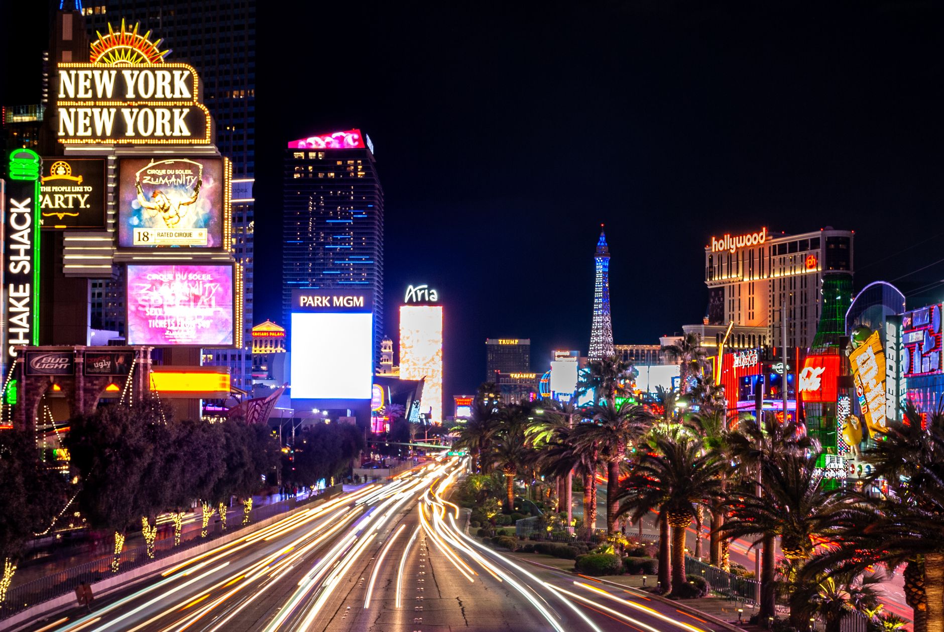 Experience the vibrant neon lights and nightlife of the iconic Las Vegas Strip at night.