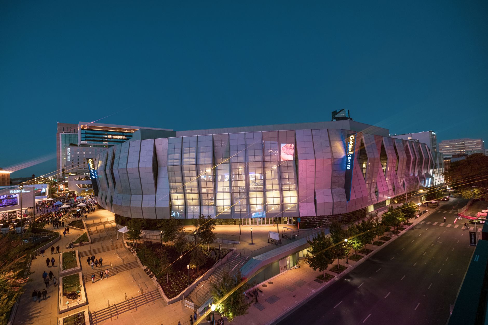 Stunning night view of the Golden 1 Center in Sacramento with vibrant lights.